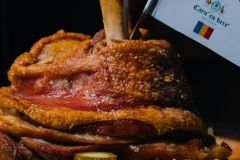 Very slowly roasted pork knuckle with braised sour cabbage, polenta, horseradish and a chilli pepper